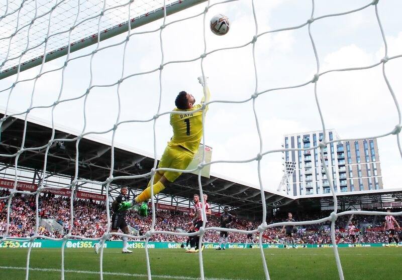 Arsenal's Gabriel Jesus heads their second goal past Brentford's David Raya. Reuters