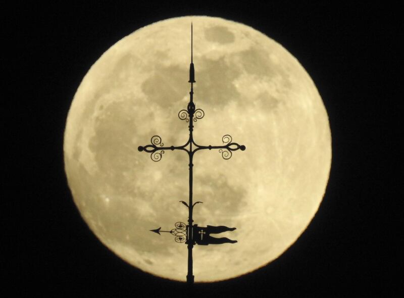 The full moon rises over the St James Cathedral in Santiago de Compostela, Galicia, northern Spain. EPA