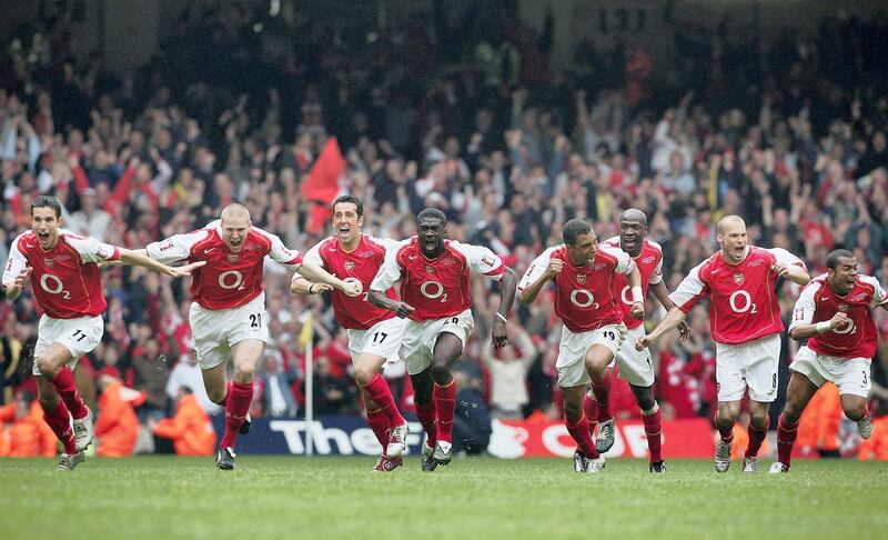 CARDIFF, UNITED KINGDOM - MAY 21:  The Arsenal team celebrate Patrick Vieira scoring the last penalty to win the FA Cup Final between Arsenal and Manchester United 5-4 at The Millennium Stadium on May 21, 2005 in Cardiff, Wales.  (Photo by Phil Cole/Getty Images)