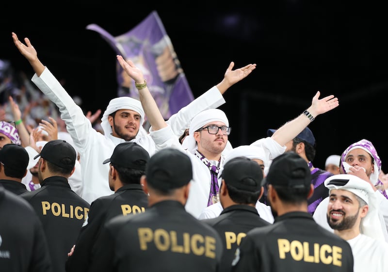 Al Ain supporters chant during the game.