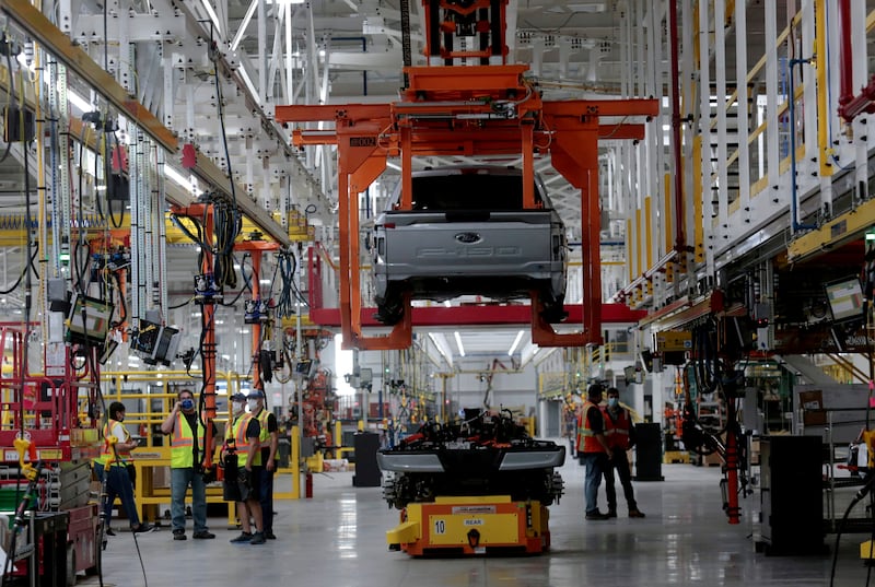 The body and chassis of a Ford pre-production all-electric F-150 Lightning truck prototype are seen at the Rouge Electric Vehicle Center in Dearborn, Michigan.   REUTERS / Rebecca Cook / File Photo / File Photo / File Photo