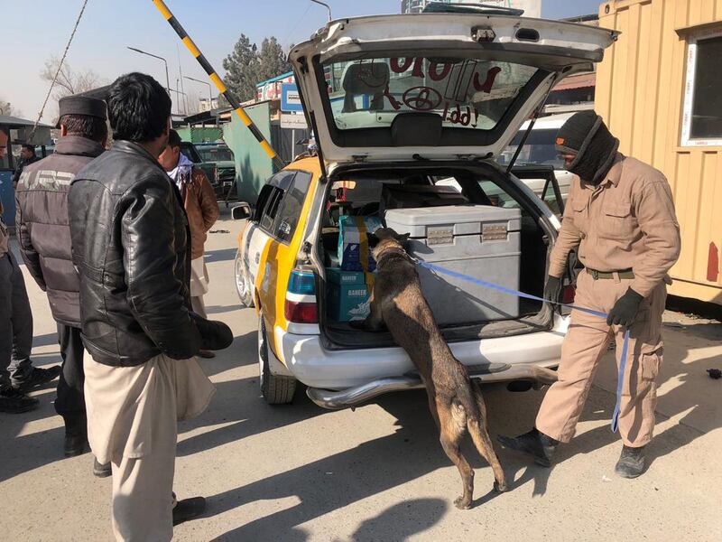 Afghan security officials check vehicles at a checkpoint in Kabul, Afghanistan. EPA