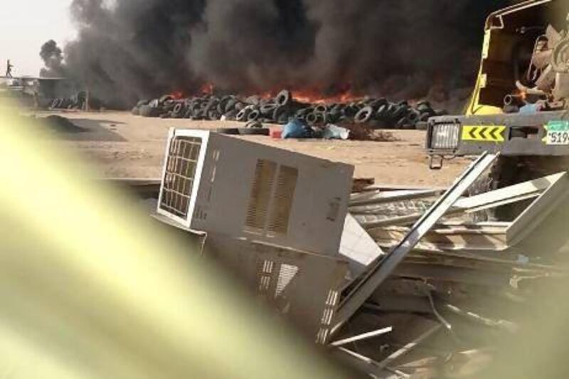 A pile of used tyres at a private fire in Madinat Zayed caught fire at the weekend, releasing dangerous emissions into the air. Photo courtesy Abdul Khan