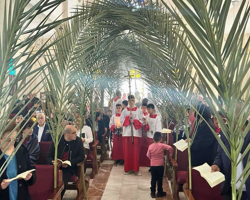 Worshippers gather at the Holy Family Church to celebrate Palm Sunday. Photo: Holy Family Church