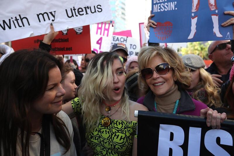 From left: actress Marcia Gay Harden, singer Miley Cyrus and Jane Fonda march during the Women’s March Los Angeles, California. Justin Sullivan / Getty Images / AFP