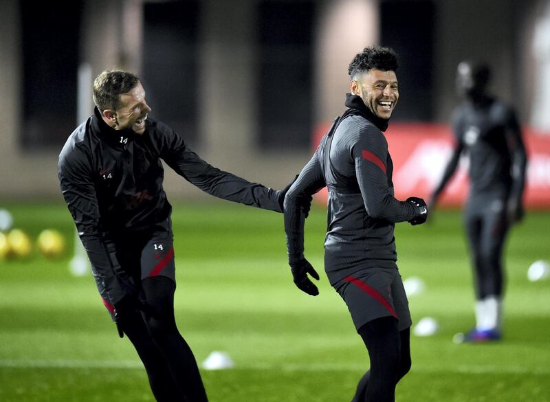 KIRKBY, ENGLAND - DECEMBER 11: (THE SUN OUT, THE SUN ON SUNDAY OUT) Alex Oxlade-Chamberlain and Jordan Henderson captain of Liverpool during a training session at AXA Training Centre on December 11, 2020 in Kirkby, England. (Photo by Andrew Powell/Liverpool FC via Getty Images)