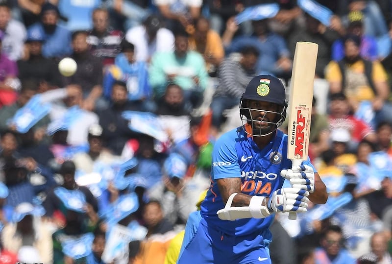 India cricketer Shikhar Dhawan plays a shot during the fourth one-day international (ODI) cricket match between India and Australia at the Punjab Cricket Association Stadium in Mohali on March 10, 2019.   / AFP / Prakash SINGH
