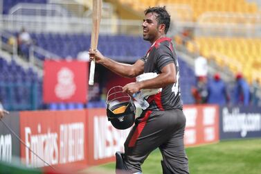 Abu Dhabi, United Arab Emirates, October 27, 2019. T20 UAE v Canada-AUH- -- Mohammad Usman of the UAE team raises his bat to the crowd. Victor Besa/The National Section: SP Reporter: Paul Radley