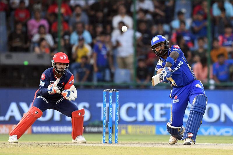 Delhi Daredevils wicketkeeper Rishabh Pant (L) watches as Mumbai Indians cricketer Suryakumar Yadav plays a shot during the 2018 Indian Premier League (IPL) Twenty20 cricket match between Delhi Daredevils and Mumbai Indians at the Feroz Shah Kotla cricket stadium in New Delhi on May 20, 2018. / AFP PHOTO / PRAKASH SINGH / ----IMAGE RESTRICTED TO EDITORIAL USE - STRICTLY NO COMMERCIAL USE----- / GETTYOUT