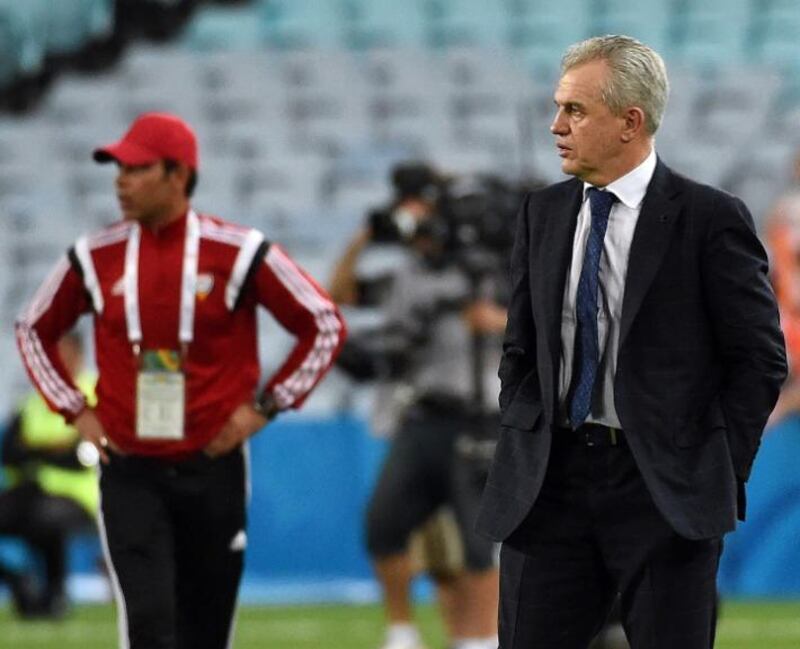 Japan coach Javier Aguirre, right, looks on during the Asian Cup quarter-final against the UAE. Saeed Khan/AFP