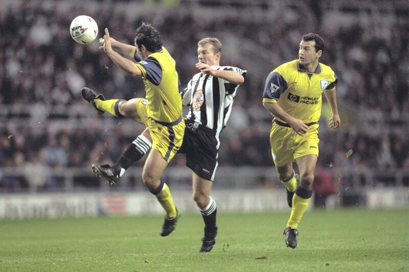 28 Dec 1996:  Alan Shearer of Newcastle beats Stephen Carr of Tottenham to score during their Premier League match at St. James Park, Newcastle. Newcastle won 7-1. Mandatory Credit: Mark Thompson/Allsport