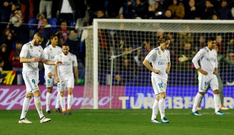 Soccer Football - La Liga Santander - Levante vs Real Madrid - Ciutat de Valencia, Valencia, Spain - February 3, 2018   Real Madrid’s Luka Modric, Karim Benzema and team mates look dejected after Levante’s second goal   REUTERS/Heino Kalis