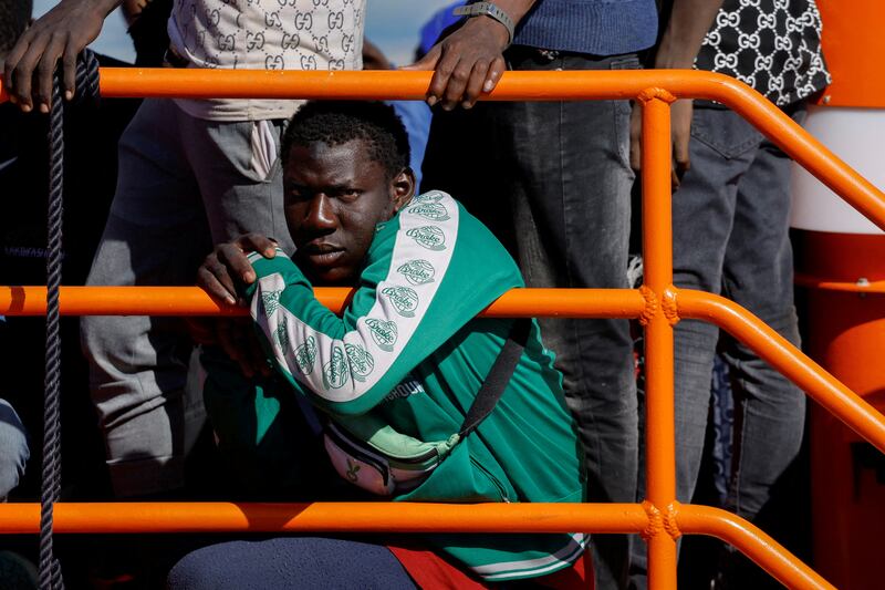 Migrants wait to disembark from a Spanish coast guard vessel in the port of Arguineguin, on the island of Gran Canaria. Reuters
