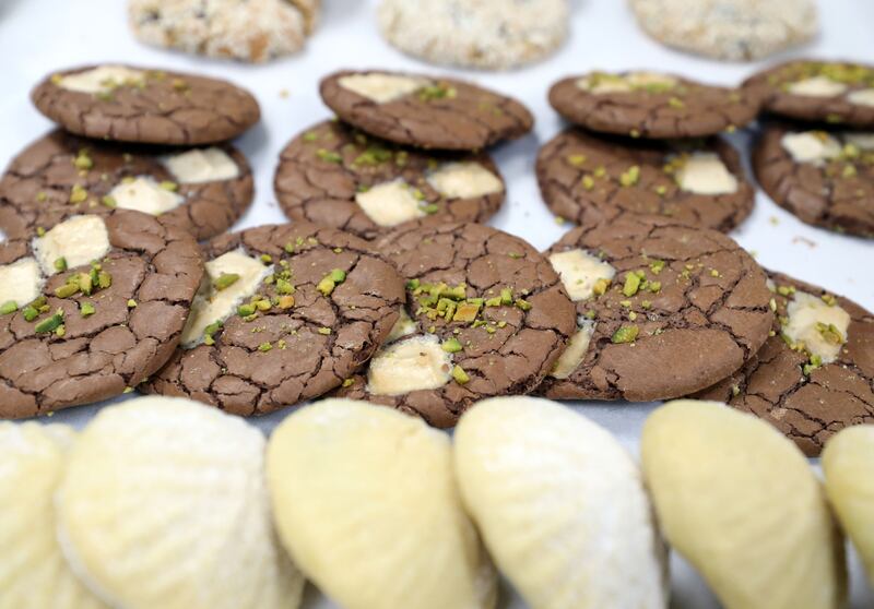 Halwa and pistachio chewy melts and pistachio and Nutella maamoul on display.