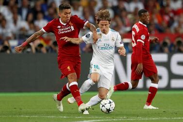 Liverpool forward Roberto Firmino, left, and Real Madrid midfielder Luka Modric remain integral parts of their respective teams, nearly three years after the 2018 Champions League final. Reuters