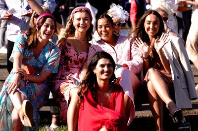 Racegoers during Ladies Day of the 2023 Derby Festival at Epsom Downs racecourse on Friday. PA

