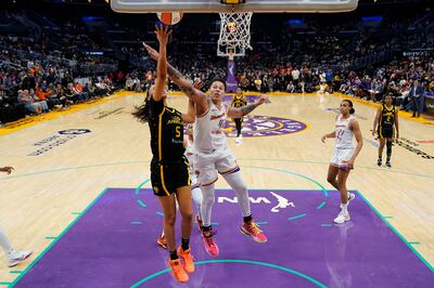 Los Angeles Sparks guard Dearica Hamby shoots against Phoenix Mercury center Brittney Griner during the second half of a WNBA basketball game in Los Angeles. AP