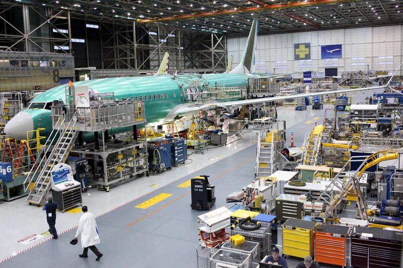A 737 MAX plane at the Boeing plant in Renton, Washington. The company will cut more jobs on Friday. Matt Mills McKnight / Reuters