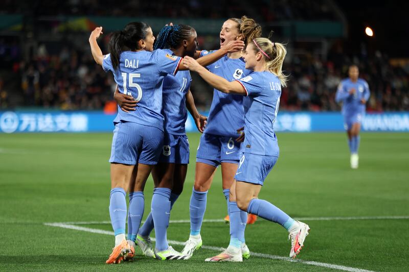 Kadidiatou Diani, second left, of France celebrates with teammates after scoring her team's opener. Getty 
