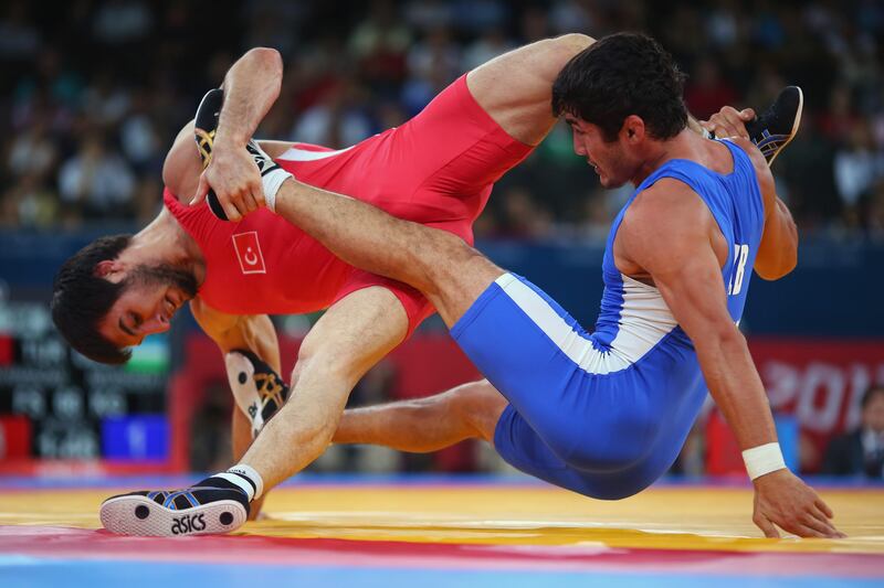 LONDON, ENGLAND - AUGUST 12: Ramazan Sahin of Turkey in action against Ikhtiyor Navruzov of Uzbekistan during the Men's Freestyle 66 kg Wrestling repechage fight on Day 16 of the London 2012 Olympic Games at ExCeL on August 12, 2012 in London, England.  (Photo by Ryan Pierse/Getty Images) *** Local Caption ***  150204059.jpg