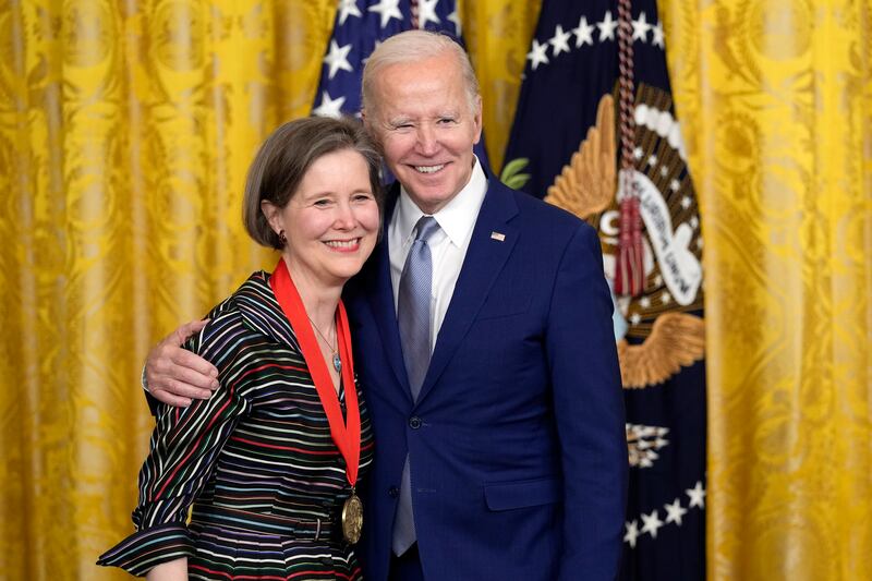 Mr Biden presents the 2021 National Humanities Medal to bestselling author Ann Patchett. AP