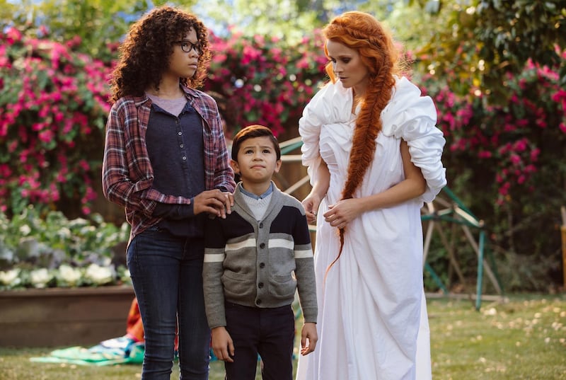 This image released by Disney shows Storm Reid, from left, Deric McCabe and Reese Witherspoon in a scene from "A Wrinkle In Time." (Atsushi Nishijima/Disney via AP)