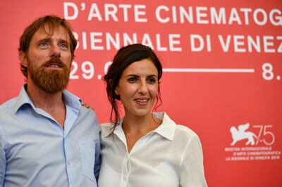 Director Alessio Romenzi and director Francesca Mannochi attend a photocall for the film "Isis, Tomorrow. The Lost Souls of Mosul" on August 30, 2018, presented out of competition during the 75th Venice Film Festival at Venice Lido. / AFP PHOTO / Vincenzo PINTO