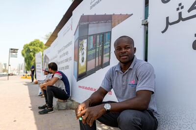 Abu Dhabi, United Arab Emirates - August 14, 2018: Bus user Brain Ekole. A new bus shelter being built in Abu Dhabi. A story on the reaction from users of the bus service to the new shelters. Tuesday, August 14th, 2018 on Sultan bin Zayed the 1st Street, Abu Dhabi. Chris Whiteoak / The National