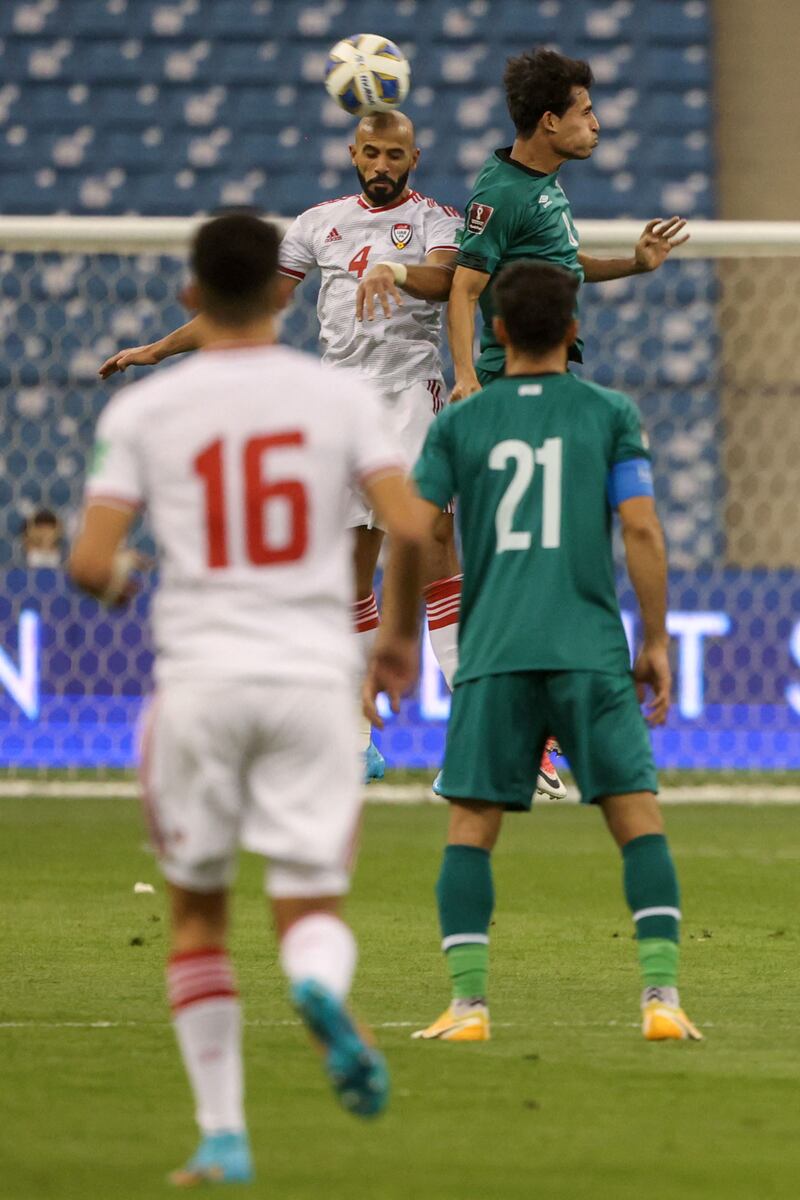 UAE's defender Mohammed Marzooq heads the ball forward. AFP