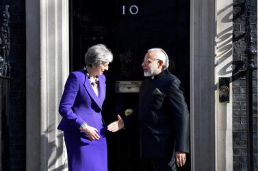 Outgoing UK Prime Minister Theresa May greets Narendra Modi in April. Britain's relationship with India is a fraught and complex one. EPA