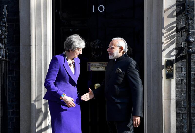 epa06676320 British Prime Minster Theresa May (L) welcomes Indian Prime Minister Narendra Modi (R) before their meeting at 10 Downing Street in London, Britain,18 April 2018. Modi is in Britain on a four-day visit where he is expected to hold bilateral talks with Britain's Prime Minister Theresa May and meeting with Queen Elizabeth II at Buckingham Palace.  EPA/ANDY RAIN