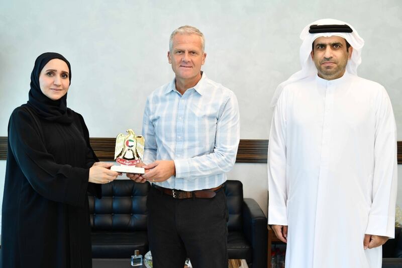 Hessa Al Malek, adviser to the Minister for Maritime Transport Affairs, Ministry of Energy and Infrastructure, honours Andy Bowerman, regional director of the Mission to Seafarers charity.