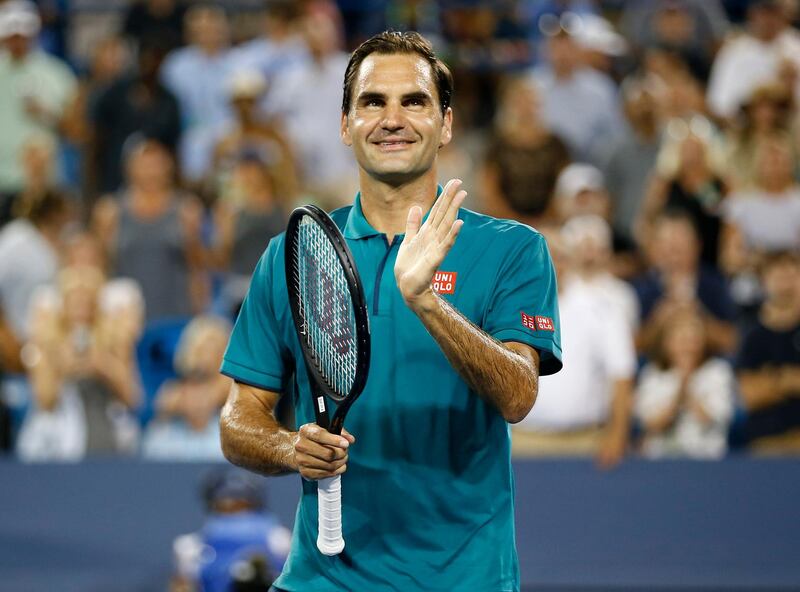 Roger Federer claps for fans as they cheer him on after defeating Juan Ignacio Londero at the Western & Southern Open tennis tournament in Mason, Ohio, Tuesday, Aug. 13, 2019. (Sam Greene/The Cincinnati Enquirer via AP)