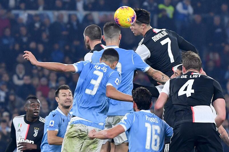 Juventus forward Cristiano Ronaldo and Lazio's Brazilian defender Luiz Felipe contest a header during the Italian Serie A football matchat the Olympic stadium in Rome. AFP