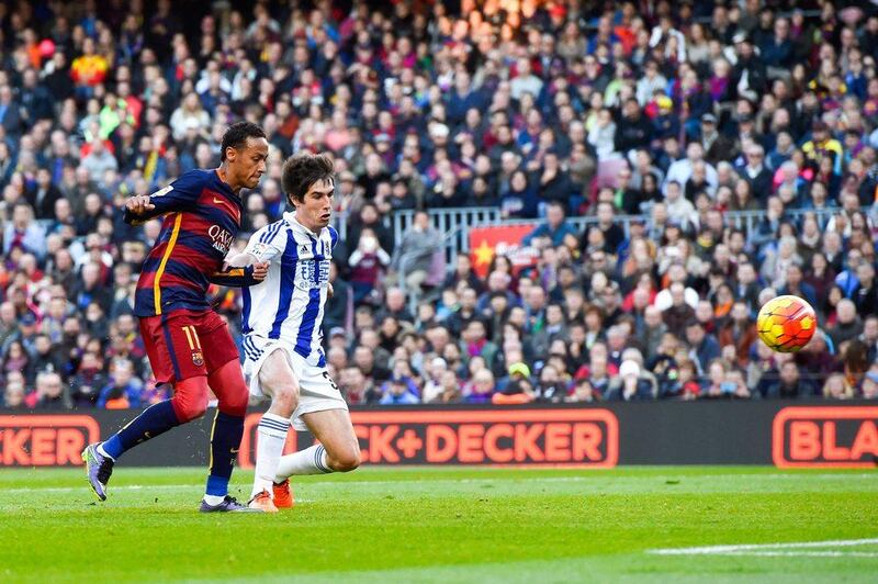Neymar scores Barcelona’s opening goal past Elustondo of Real Sociedad.  David Ramos/Getty Images