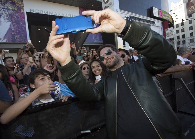 Cast member Bradley Cooper takes a selfie with fans at the premiere of Guardians of the Galaxy in Hollywood, California on July 21, 2014. The movie opens in the US on August 1. Mario Anzuoni / Reuters