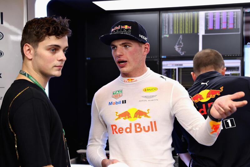 ABU DHABI, UNITED ARAB EMIRATES - NOVEMBER 24:  Max Verstappen of Netherlands and Red Bull Racing talks with superstar DJ Martin Garrix in the Red Bull Racing garage after practice for the Abu Dhabi Formula One Grand Prix at Yas Marina Circuit on November 24, 2017 in Abu Dhabi, United Arab Emirates.  (Photo by Mark Thompson/Getty Images)