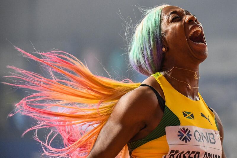 TOPSHOT - Jamaica's Shelly-Ann Fraser-Pryce celebrates after winning the Women's 100m final at the 2019 IAAF World Athletics Championships at the Khalifa International Stadium in Doha on September 29, 2019. / AFP / Jewel SAMAD
