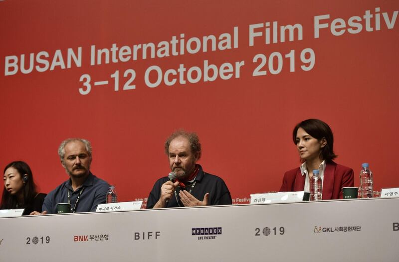 British film director Mike Figgis (C) speaks during a press conference for the New Currents Jury for the Busan International Film Festival (BIFF) in Busan. BIFF runs from October 3 to 12 and features 303 films from 85 countries.  AFP
