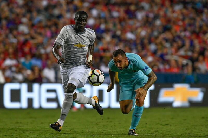 Manchester United's Eric Bailly and Barcelona's Paco Alcacer. Larry French / AP Photo