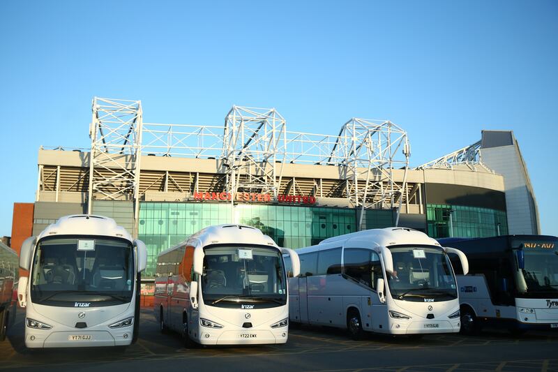 Coaches waiting to take Manchester United fans to Wembley outside Old Trafford. PA