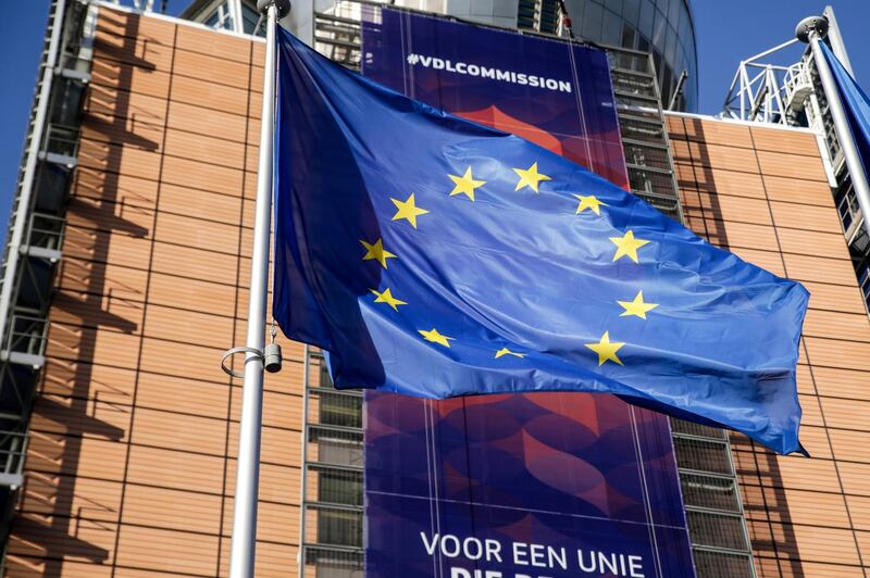 An European Union flag flies in front of the European Commission headquarters in Brussels on December 3, 2019.  / AFP / Aris Oikonomou
