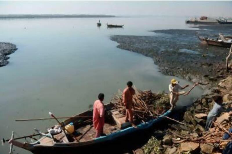 Pakistani fishermen prepare their boats before a fishing trip in Rerhy in the outskirts of Karachi. These victims of the border dispute between the two nations are largely forgotten.