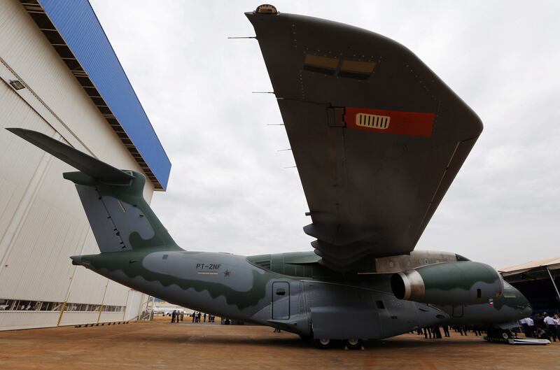 Above, Embraer unveils the KC-390 cargo aircraft in 2014. Paulo Whitaker / Reuetrs