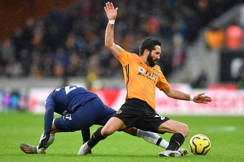 Tottenham Hotspur's Lucas Moura (L) vies with Wolverhampton Wanderers'   midfielder Joao Moutinho. AFP
