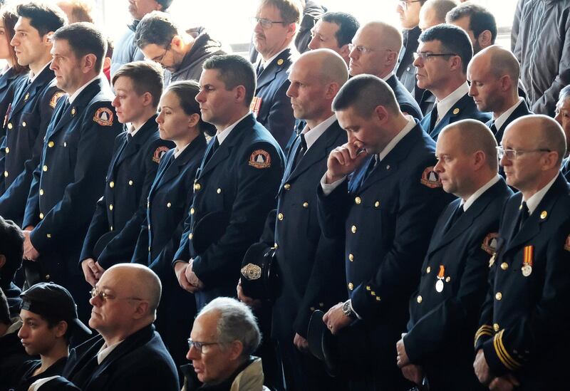 Halifax firefighters listen during a funeral service for a Syrian refugee family who lost seven children in a February 19 house fire in Halifax, Nova Scotia, Canada February 23, 2019. Reuters