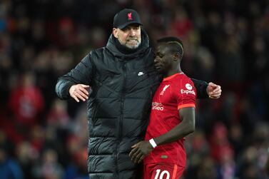 Liverpool manager Jurgen Klopp greets Sadio Mane after the final whistle following the Premier League match at Anfield, Liverpool. Picture date: Saturday March 5, 2022.