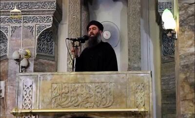 FILE PHOTO: A man purported to be the reclusive leader of the Islamic State militant group, Abu Bakr al-Baghdadi, speaks from the balcony of a mosque in Iraq's second city, Mosul, in this still image taken from a video posted on the Internet on July 5, 2014. REUTERS/Social Media Website via Reuters TV.   ATTENTION EDITORS - THIS IMAGE HAS BEEN SUPPLIED BY A THIRD PARTY. IT IS DISTRIBUTED, EXACTLY AS RECEIVED BY REUTERS, AS A SERVICE TO CLIENTS. REUTERS IS UNABLE TO INDEPENDENTLY VERIFY THE CONTENT OF THIS VIDEO, WHICH HAS BEEN OBTAINED FROM A SOCIAL MEDIA WEBSITE/File Photo