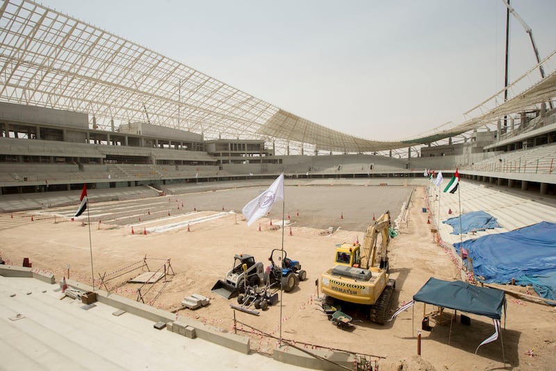 AL AIN, EASTERN REGION OF ABU DHABI, UNITED ARAB EMIRATES - May 08, 2013: Al Ain Football Club and UAE flags at the Hazza Bin Zayed Stadium, which will serve as the new home ground of Al Ain Football Club.( Ryan Carter / Crown Prince Court - Abu Dhabi ).---