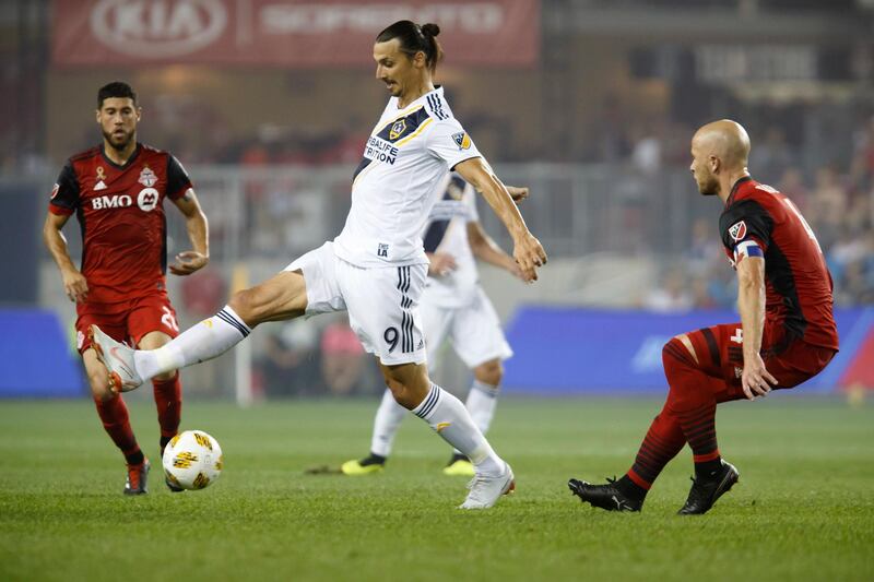 Los Angeles Galaxy forward Zlatan Ibrahimovic controls the ball against Toronto FC midfielder Michael Bradley. Canadian Press via AP